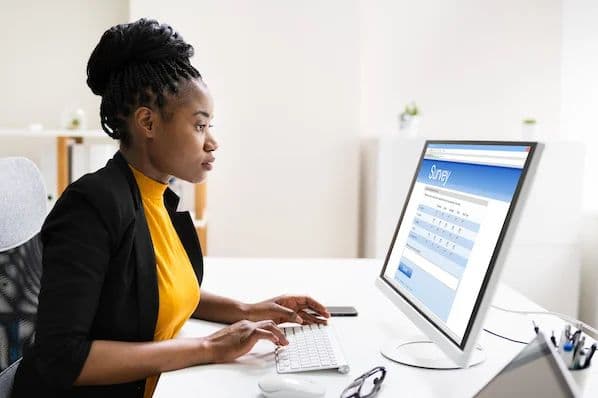 Participant carefully completing an online survey.